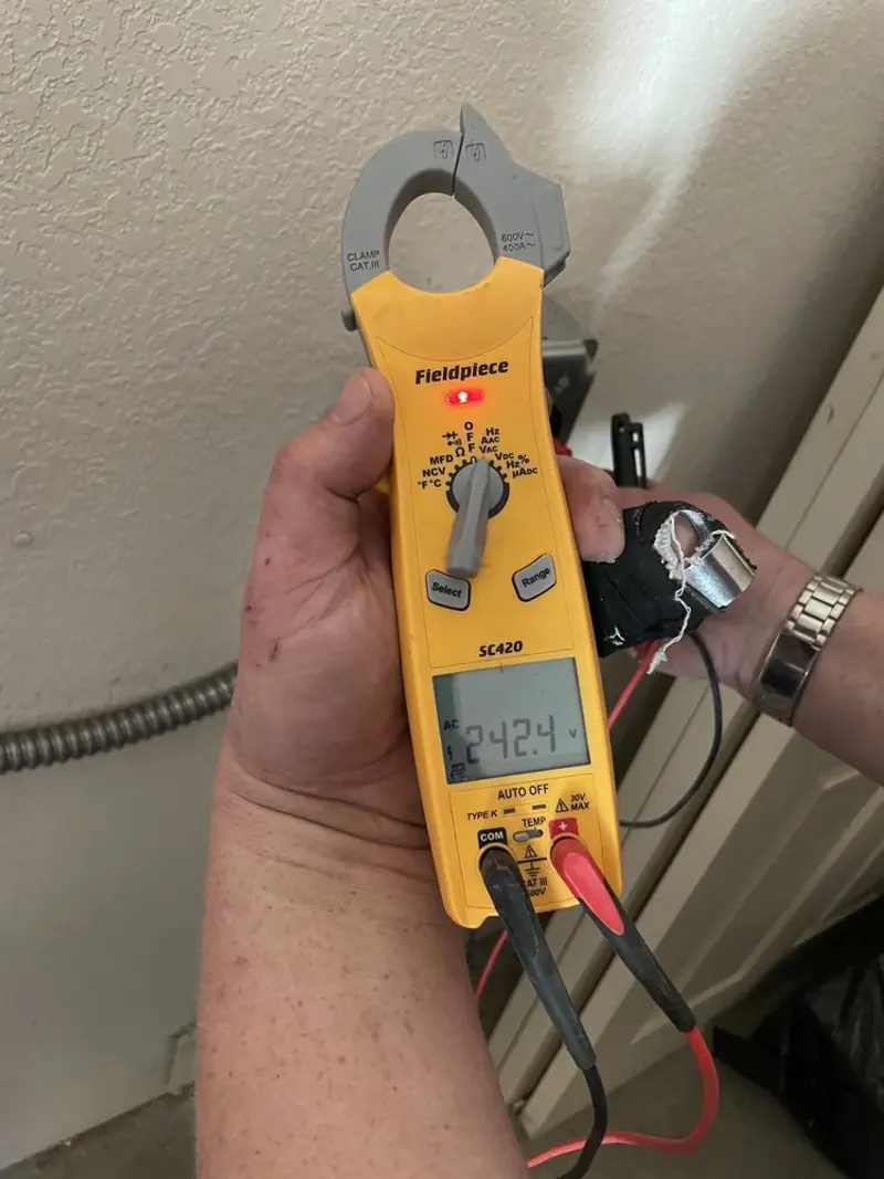 Voltage testing with clamp meter during Whole House Surge Protector in Tigard